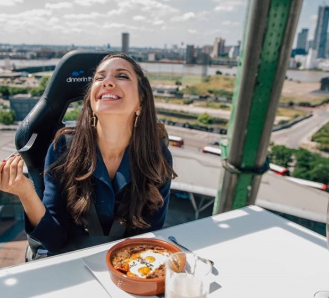 a woman eating a breakfast